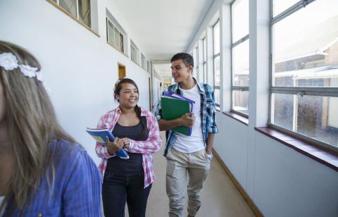 Two students walking and talking