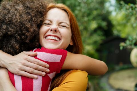 Two friends hugging