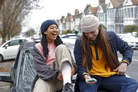 two young people laughing